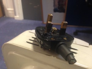 A melted plug from an heater that was still in use in an office in oxford